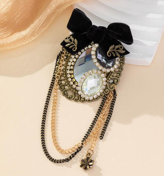 Barok broche met spiegel en diamant en parel met strik en kettingen goudkleurige met zwart 
