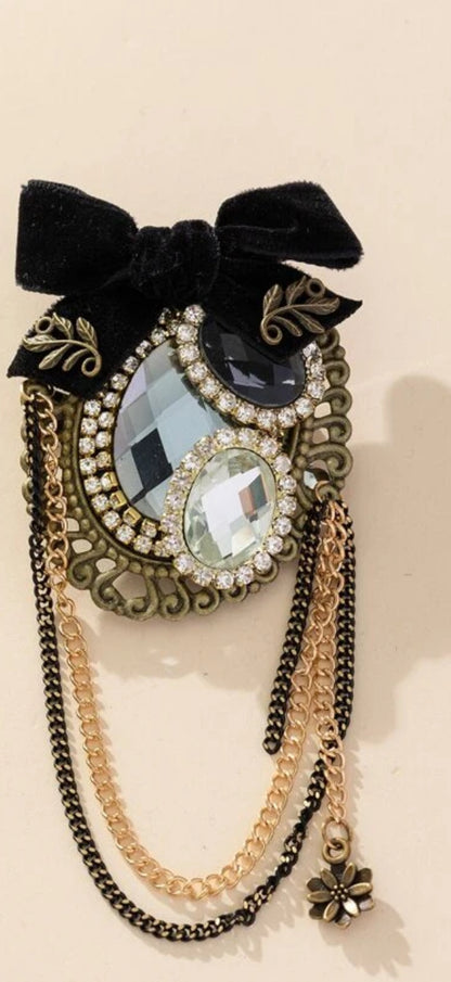 Barok broche met spiegel en diamant en parel met strik en kettingen goudkleurige met zwart 