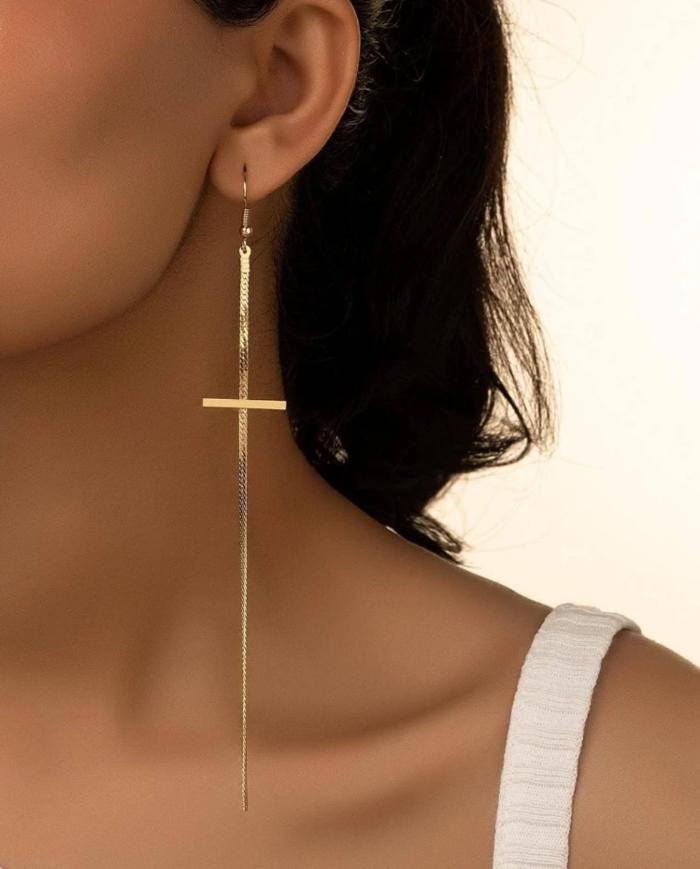 In gold we trust oorbellen lange dunnen oorbellen in de vorm van een kruis